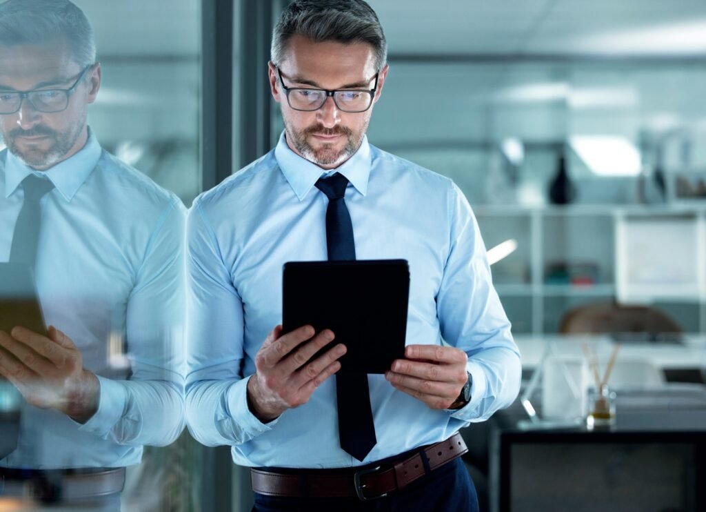 Shot of a businessman using a digital tablet at the office